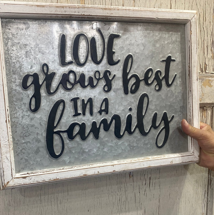 LOVE GROWS BEST IN A FAMILY METAL SIGN